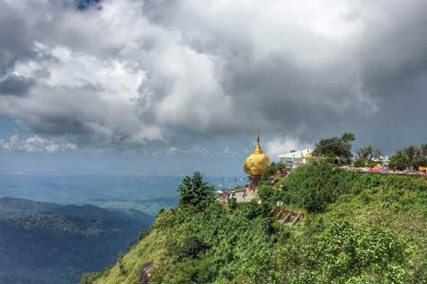Golden Rock Pagoda is famous for being built on top of a big granite rock covered by gold leaves made by the devotees