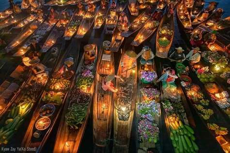 Bustling floating market in the evening on Inle lake.