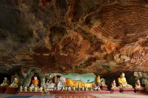 Take a boat to visit the cave temple of Pow Win Taung