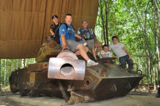 Tourists explore tanks in Cu Chi tunnels.