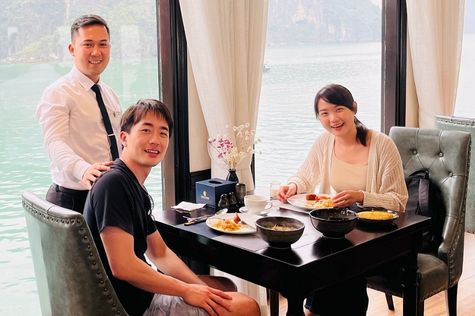 Tourist having meals on Halong Bay cruise