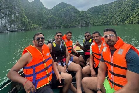 Tourists kayaking to Dark & Bright Cave