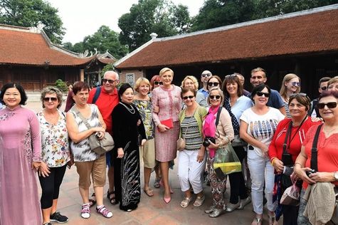 Happy tourists in Temple of Literature