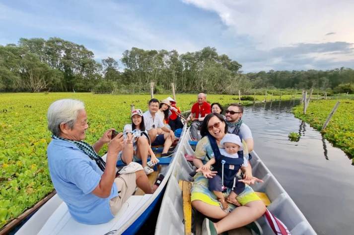 a boat ride amidst the natural beauty of Tra Su Forest
