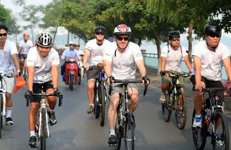 Travelers explore the picturesque Mekong Delta on two wheels