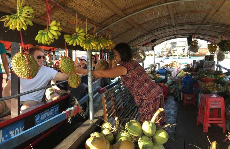 Shopping on Cai Be Floating Market